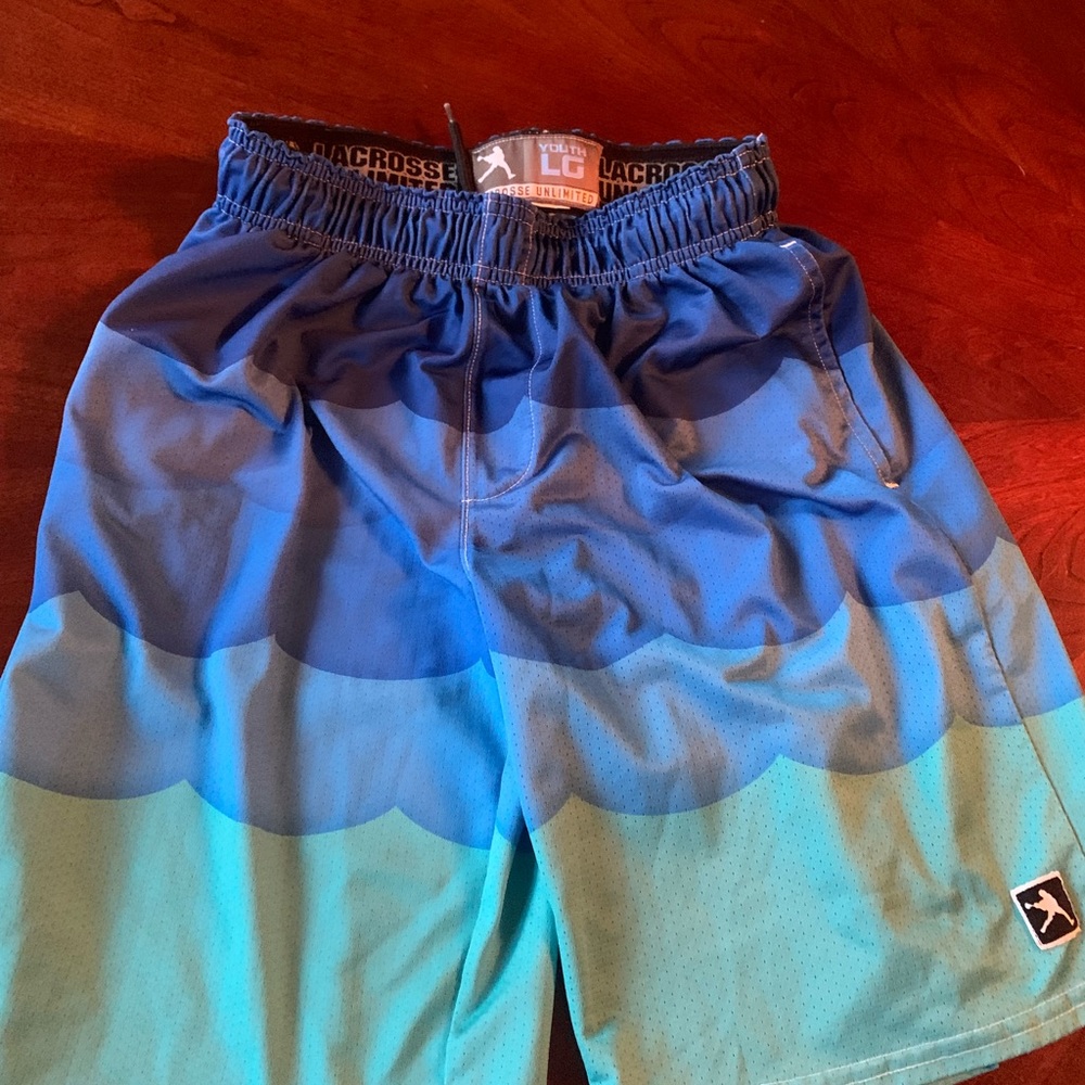 Lacrosse Unlimited brand boys lax shorts . Size large